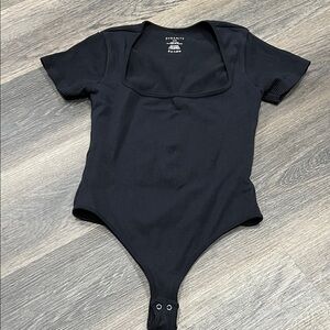 (17) Dynamite Classic Bodysuit